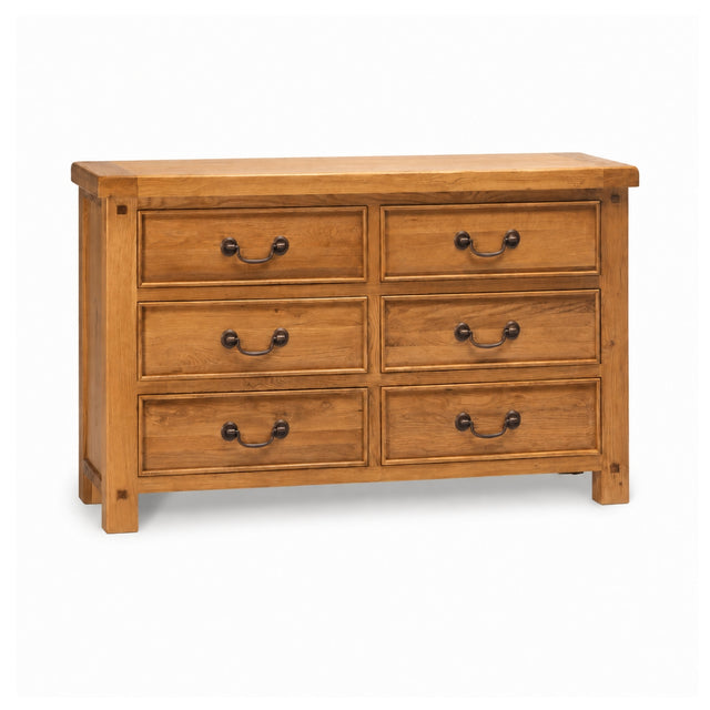 Wilma six-drawer wooden dresser with a warm medium-brown finish and dark metal drawer pulls, shown on a plain white background.