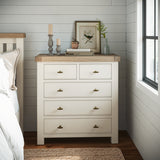 Wilson cream dresser with oak top in a bedroom setting.