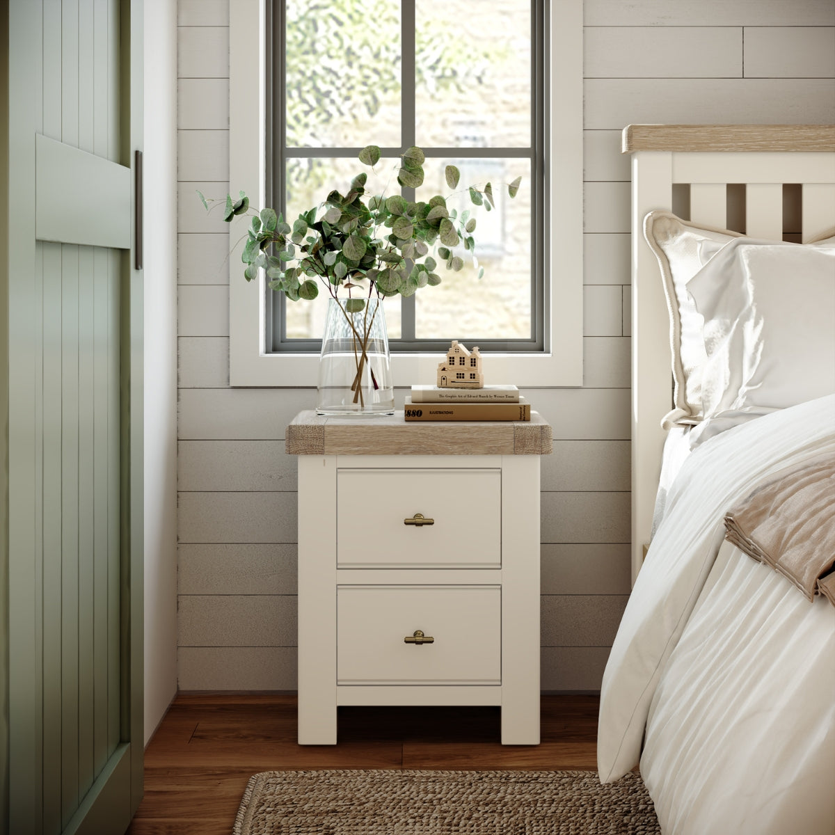 Bedroom with the Wilson nightstand, bed, and decorative elements.