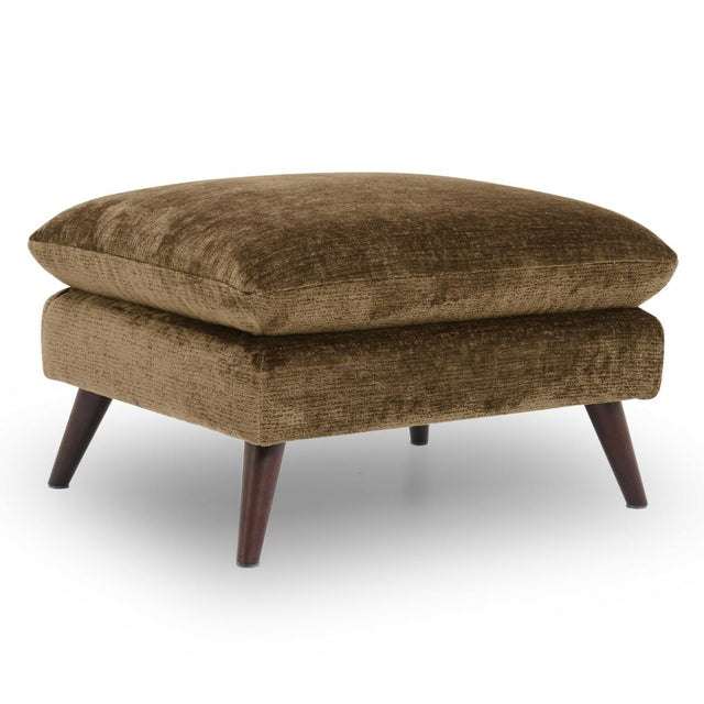 Zora ottoman with a thick cushioned top and dark tapered wooden legs, shown on a clean white background.
