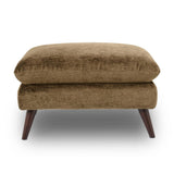 Zora upholstered ottoman with a textured brown fabric cushion and tapered dark wood legs, shown against a plain white background.