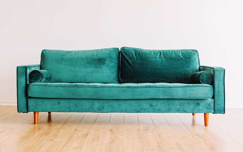 Tuxedo velvet green loveseat.