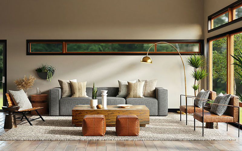Grey fabric sofa with feature chairs in large living room.