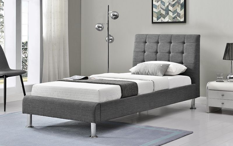 Modern grey fabric tufted headboard.