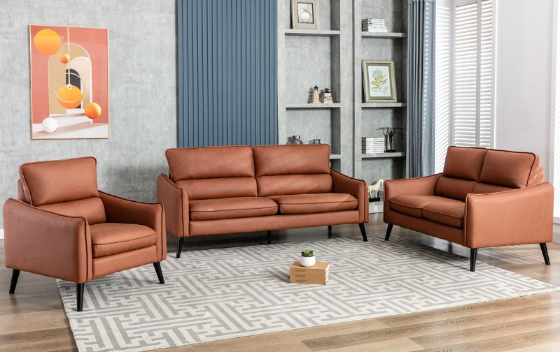 Two seater leather sofas and chairs.
