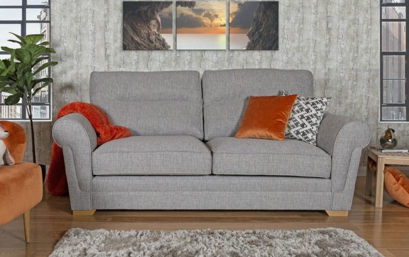 Light grey fabric covered two seater sofa with cushions.