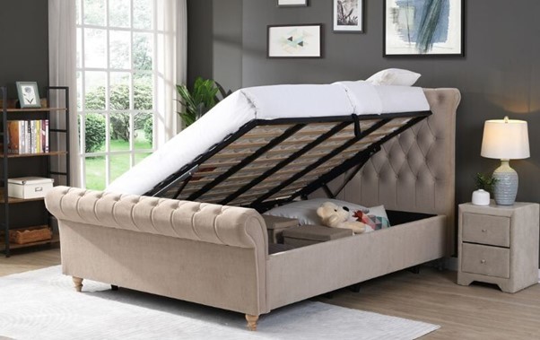 Open-ottoman-bed-with-storage-items.