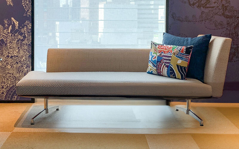 Contemporary chaise lounge with silver legs.