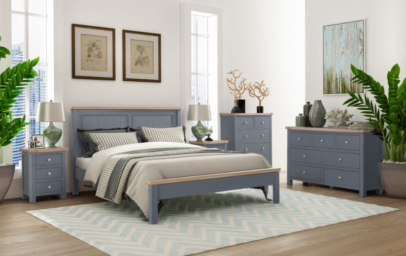 Bed-on-wooden-frame-and-blue-wooden-headboard.