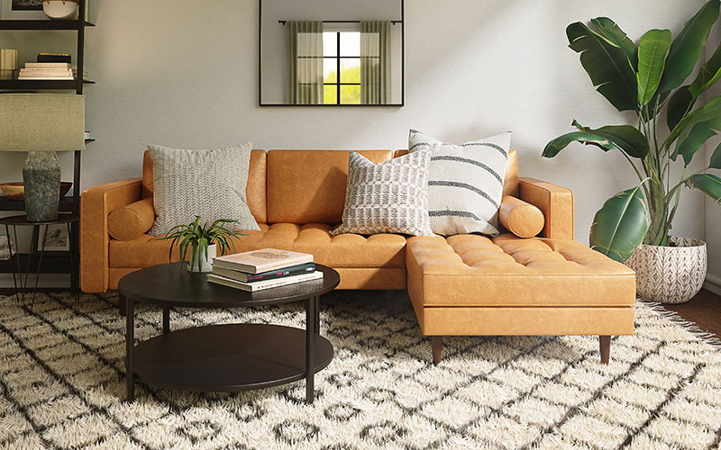 Tan velvet L-shaped sofa in large living room.