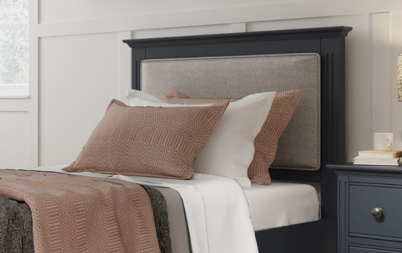 Black wooden framed headboard with grey fabric feature.