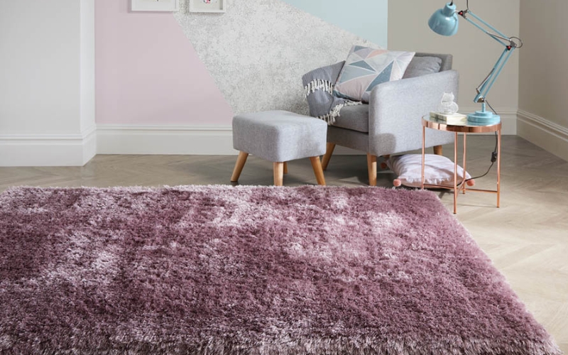 a purple rug in a room