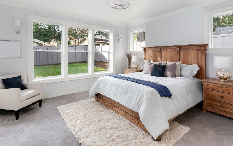 rug in bedroom with bed on rug