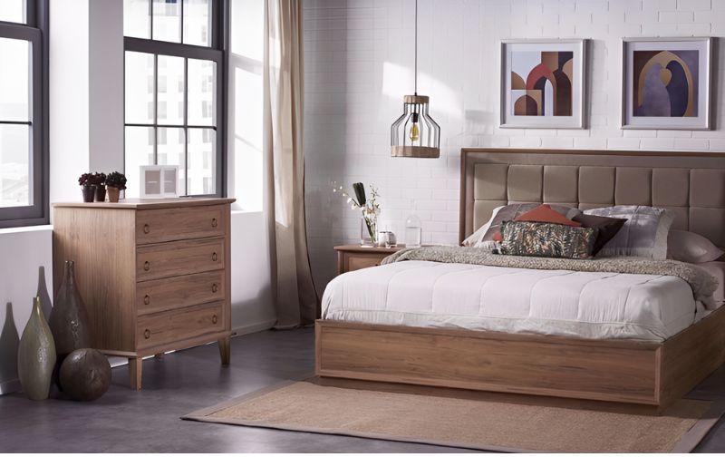 a chest of drawers placed by a window