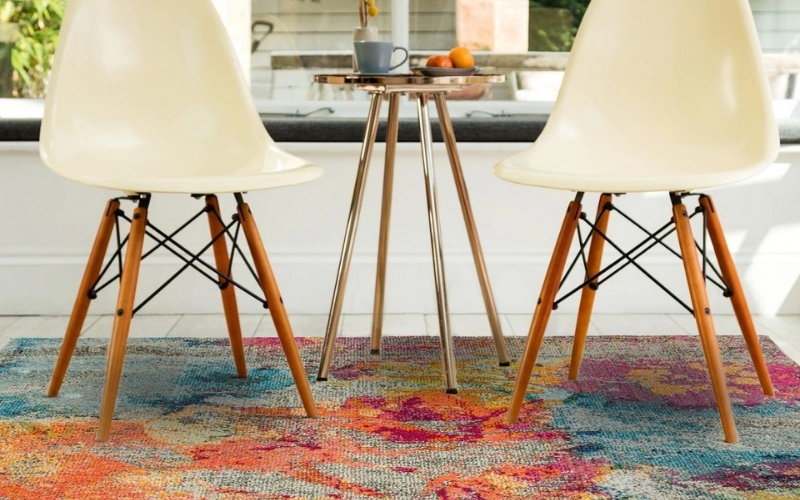 two chairs on a brightly coloured rug