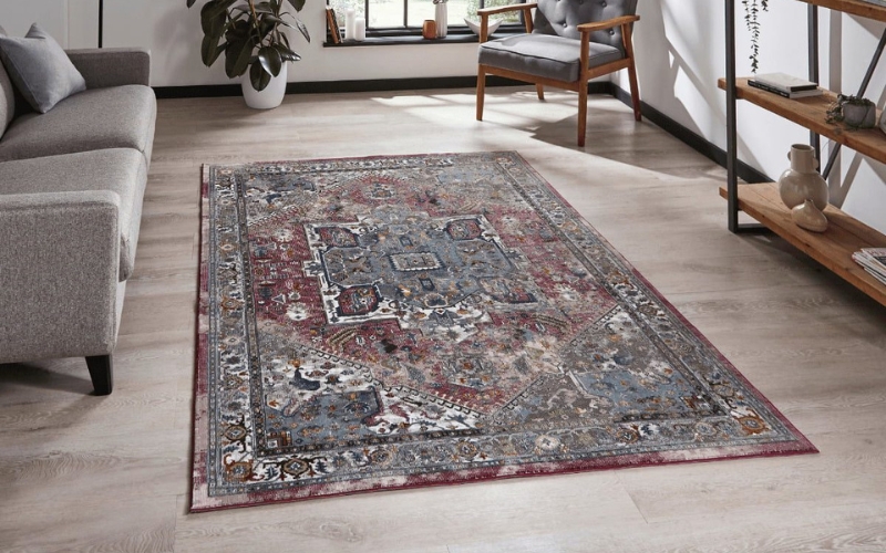 a grey persian rug on the floor