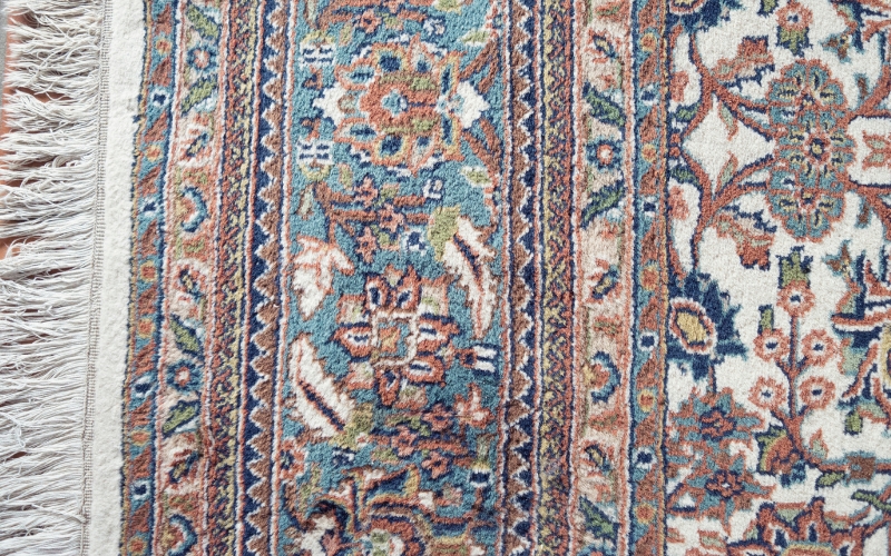 a close up of a rug type known as hand knotted rugs