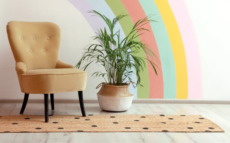 a chair resting on a spotted runner rug