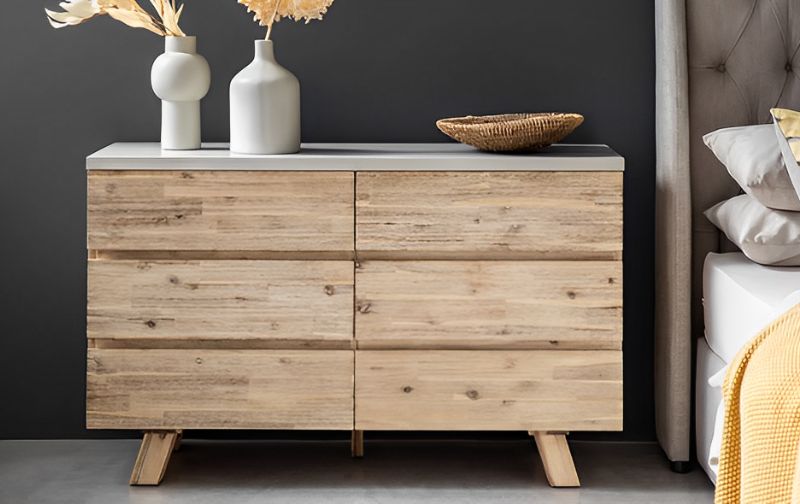 wide low wooden chest of drawers