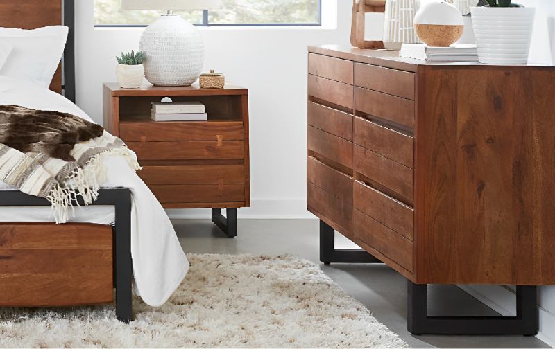 wooden 6 drawer chest in a bedroom setting